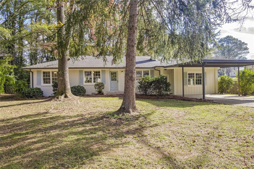 front view of a house with a yard