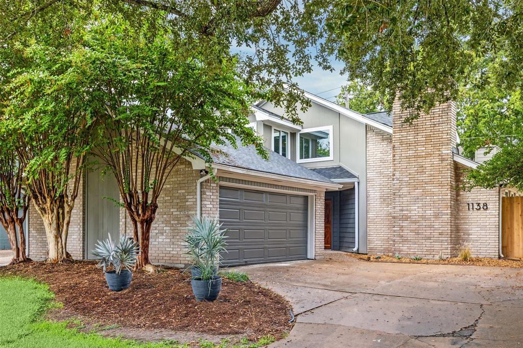 a view of a house with a tree