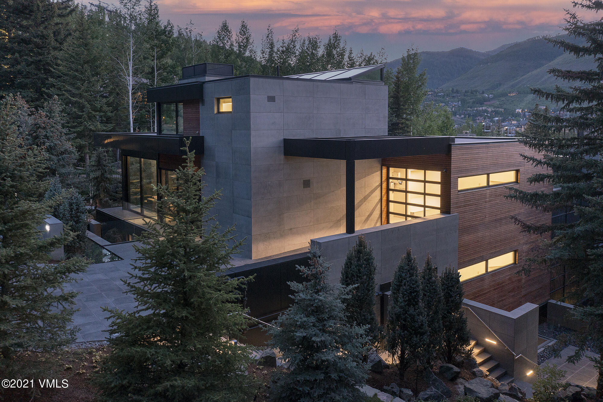 a view of a house with a yard and tree s