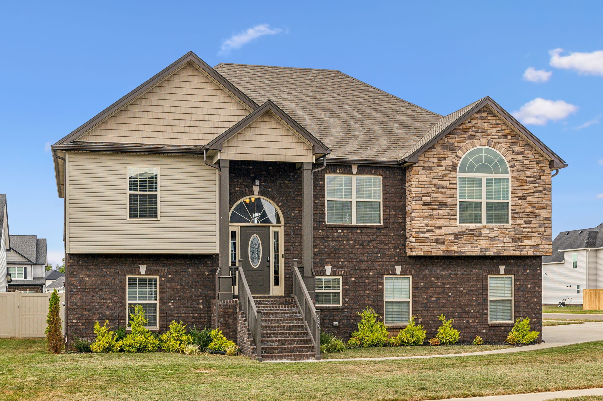 a front view of a house with a yard