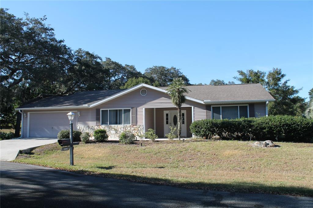 a view of house with yard