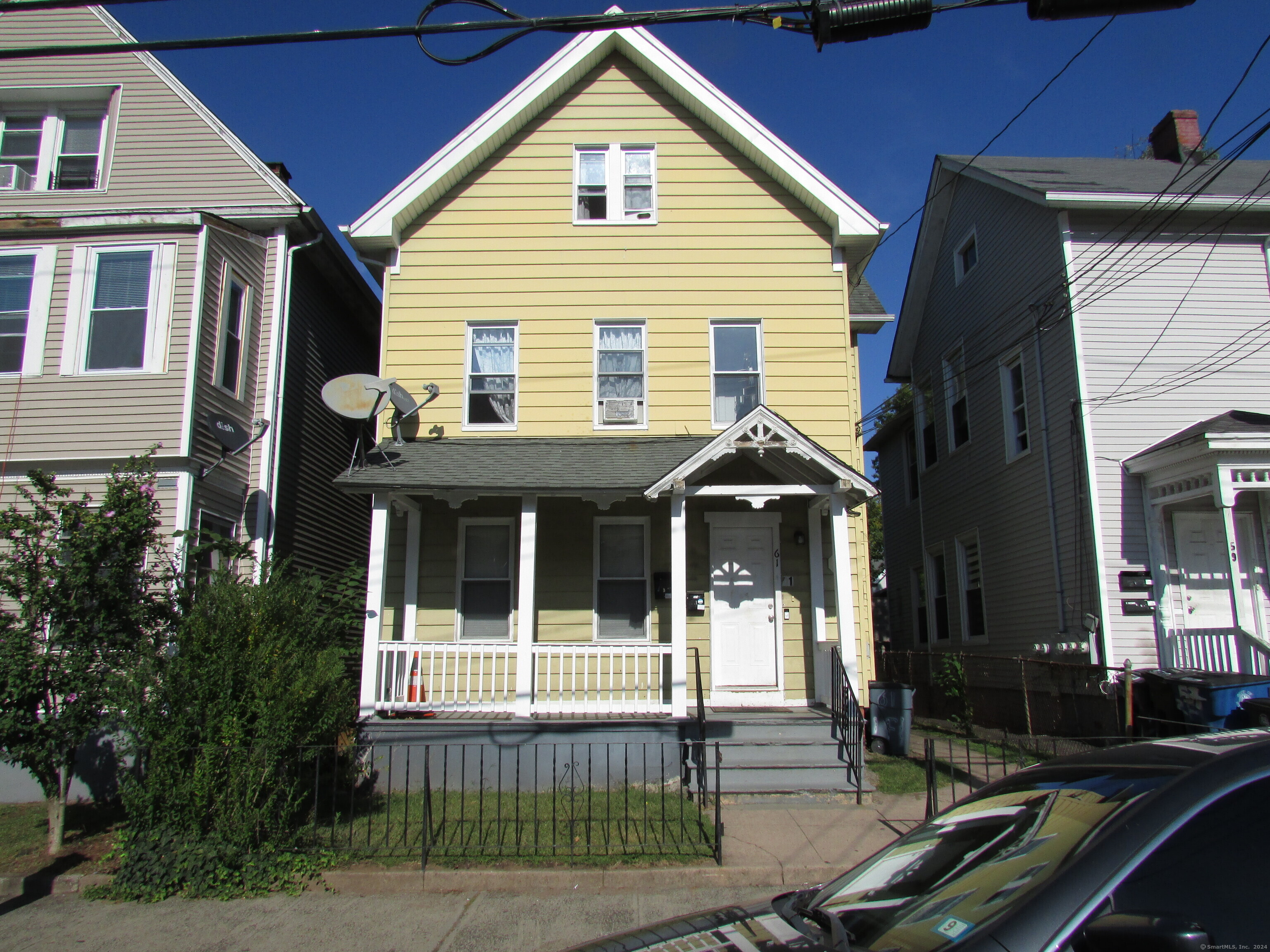 a front view of a house with a porch