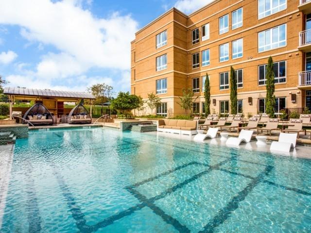 a view of pool with outdoor seating