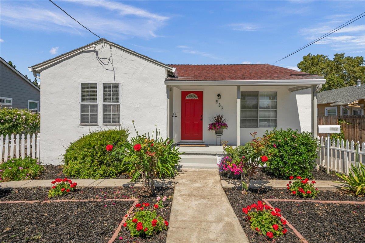 a front view of a house with a yard