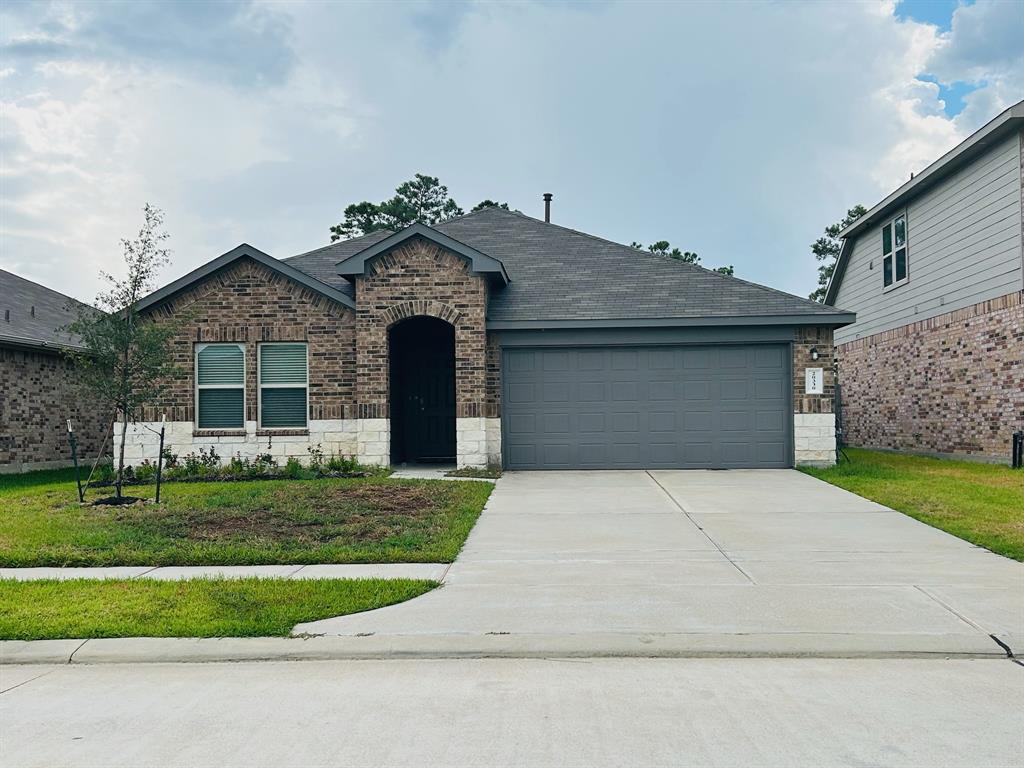 front view of a house with a yard