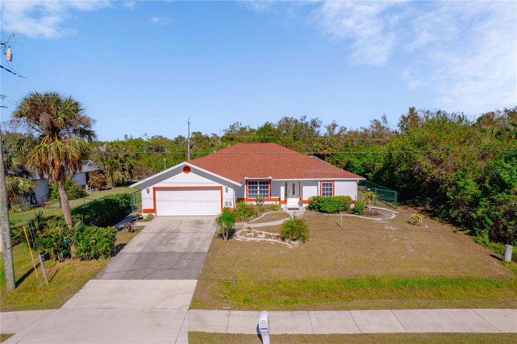 a view of house with yard and entertaining space