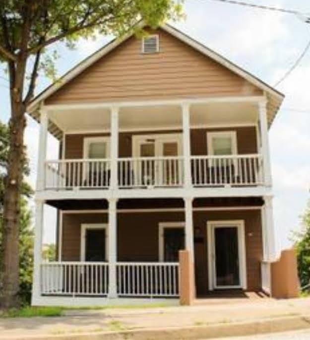 a view of a house with more windows and stairs