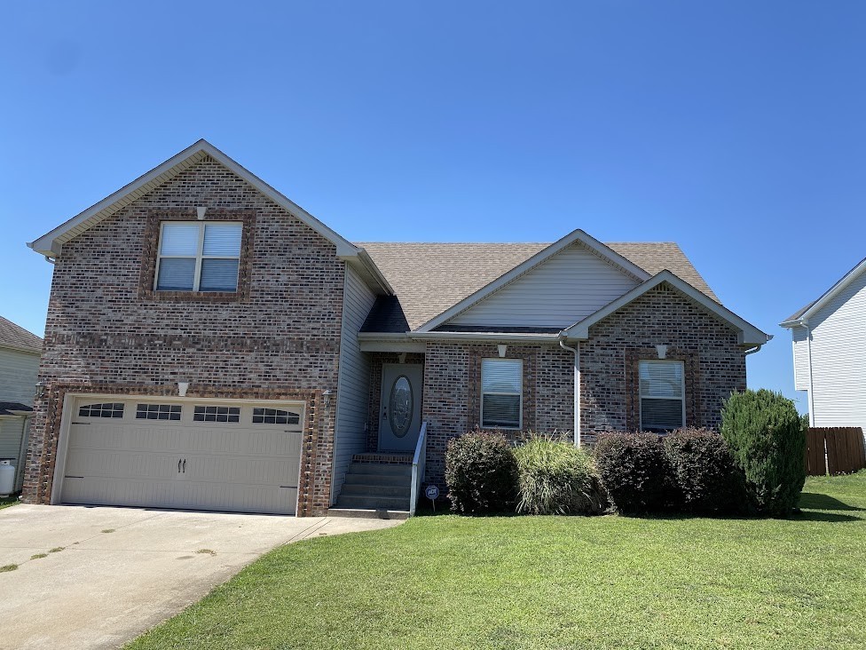 a front view of a house with a yard