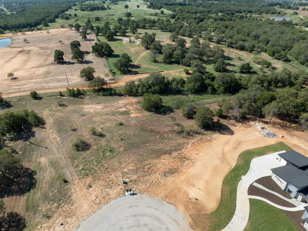 an aerial view of a house with a backyard