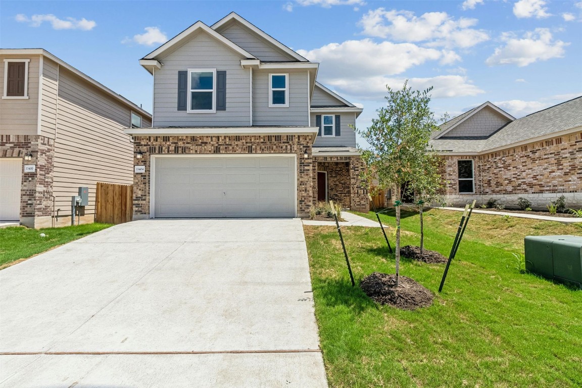 a front view of a house with a yard