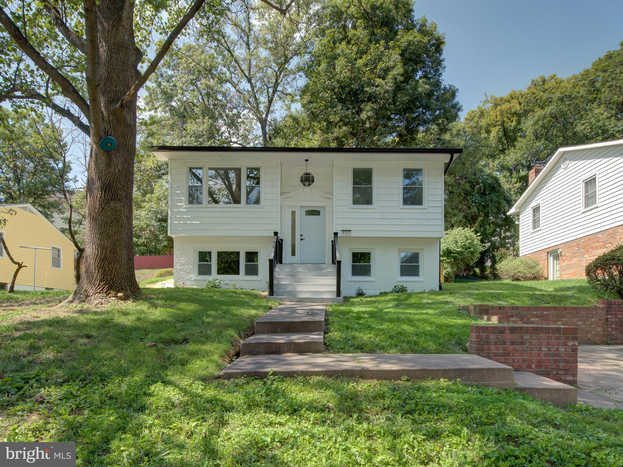 a view of house with yard