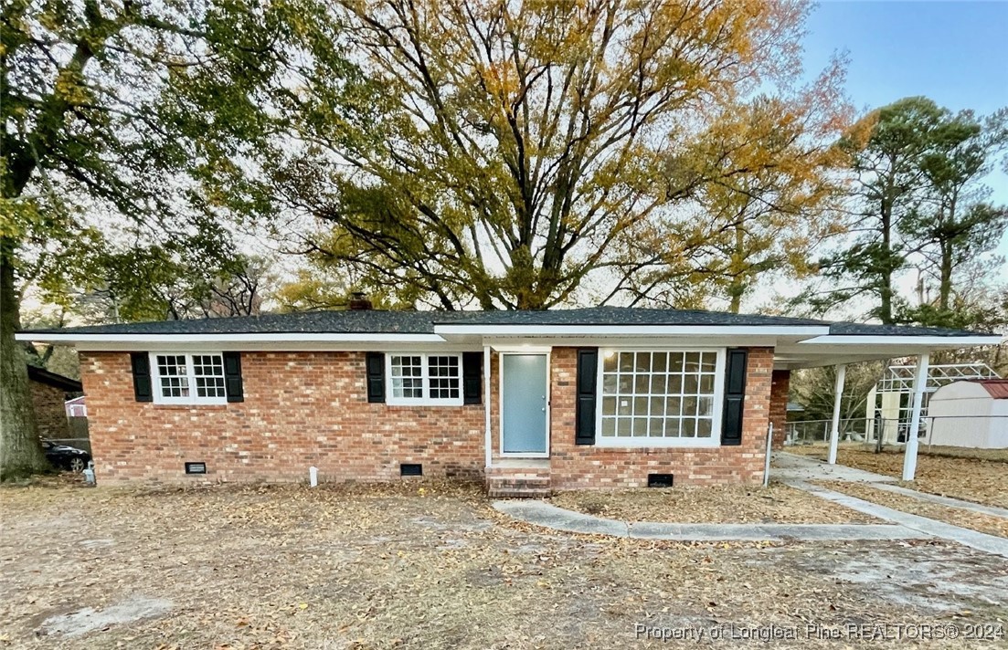 a view of a house with a backyard and balcony