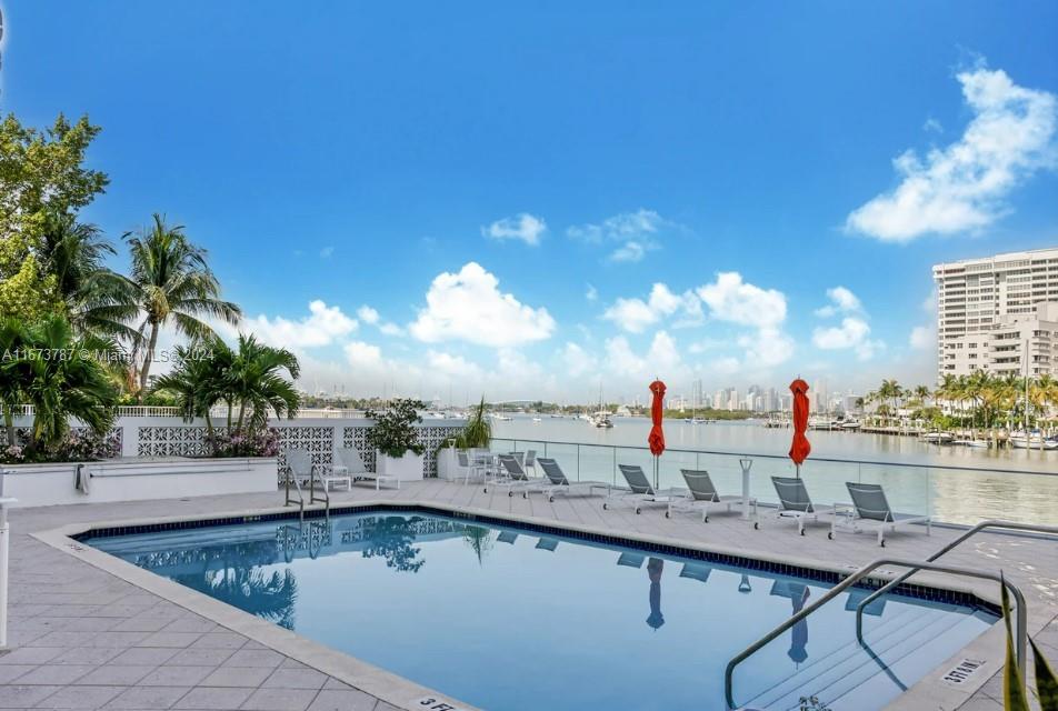 a view of a swimming pool and a chairs