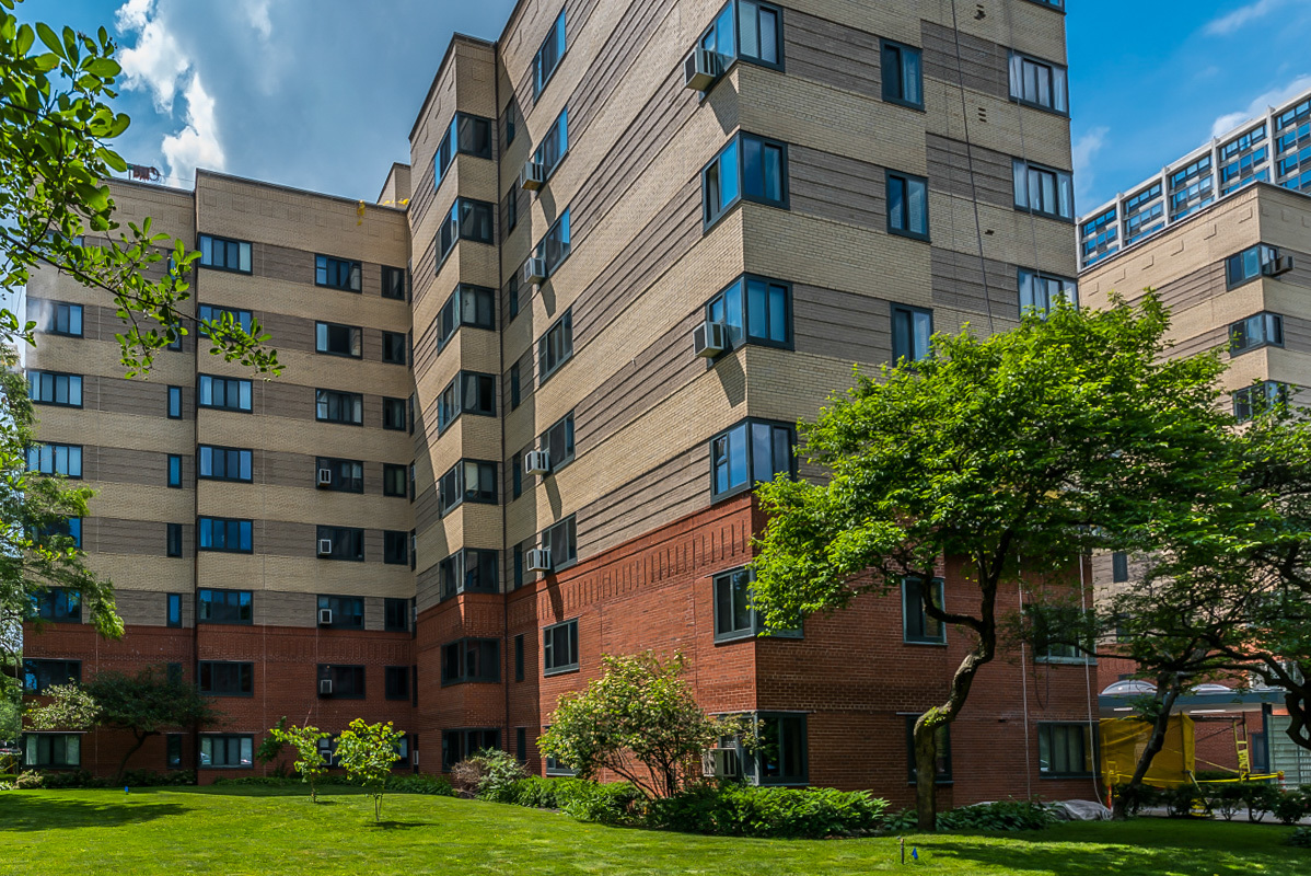 a view of a building with a yard