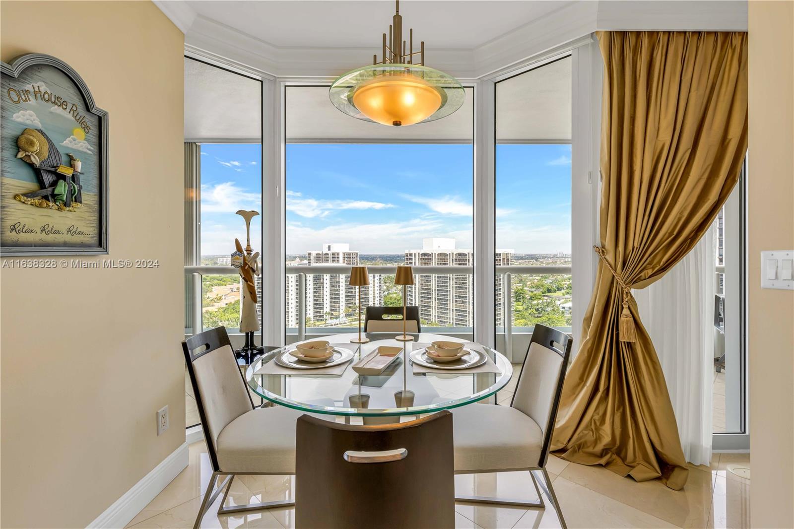 a view of a dining room with furniture wooden floor and a chandelier