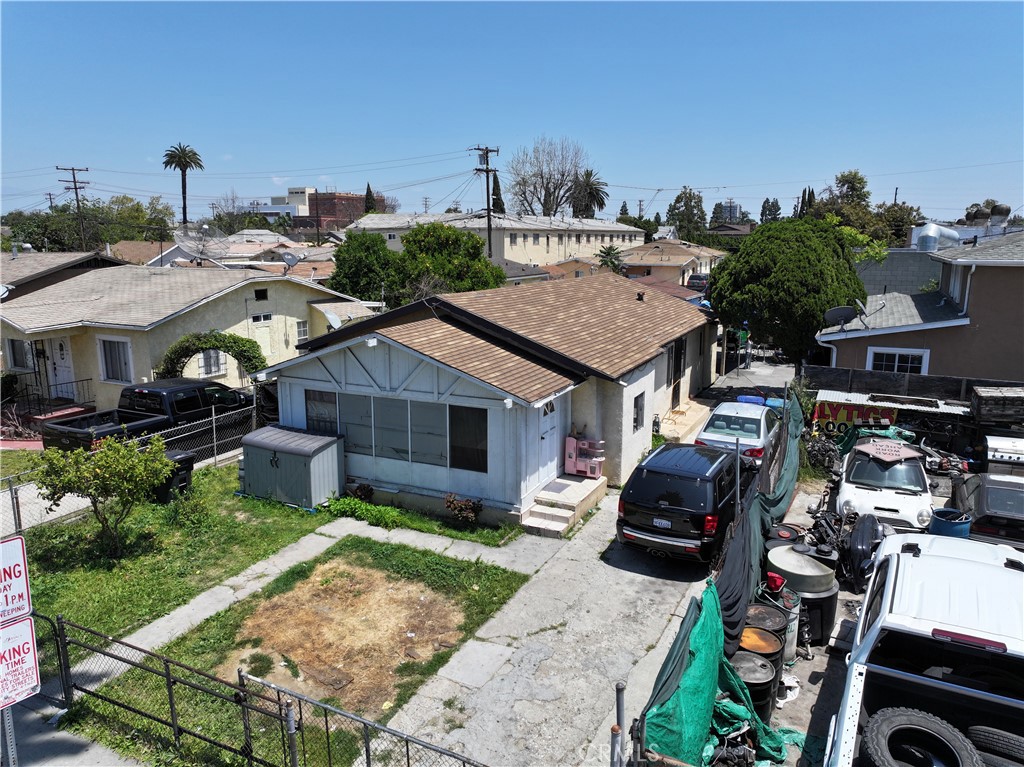 an aerial view of a house with garden space and street view