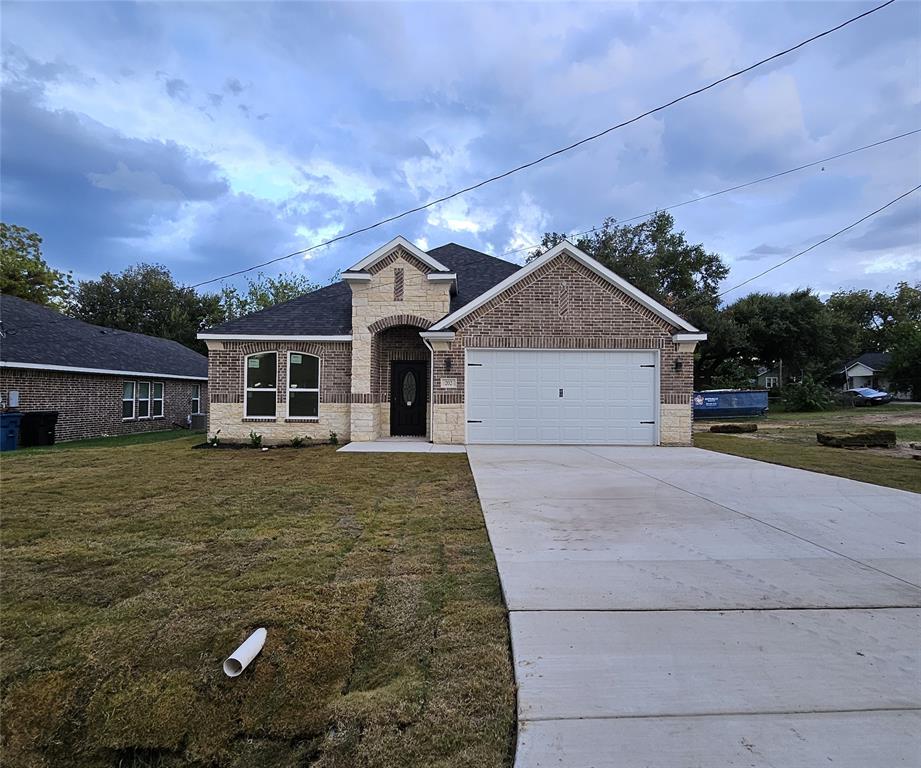 a front view of a house with a yard