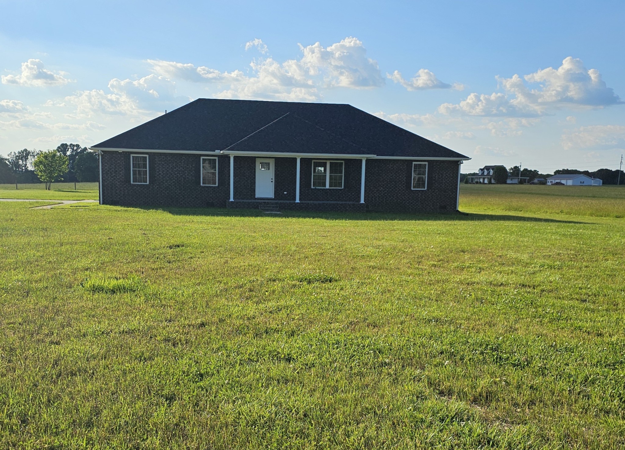 a front view of a house with yard