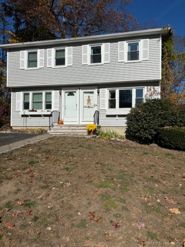 a front view of a house with swing