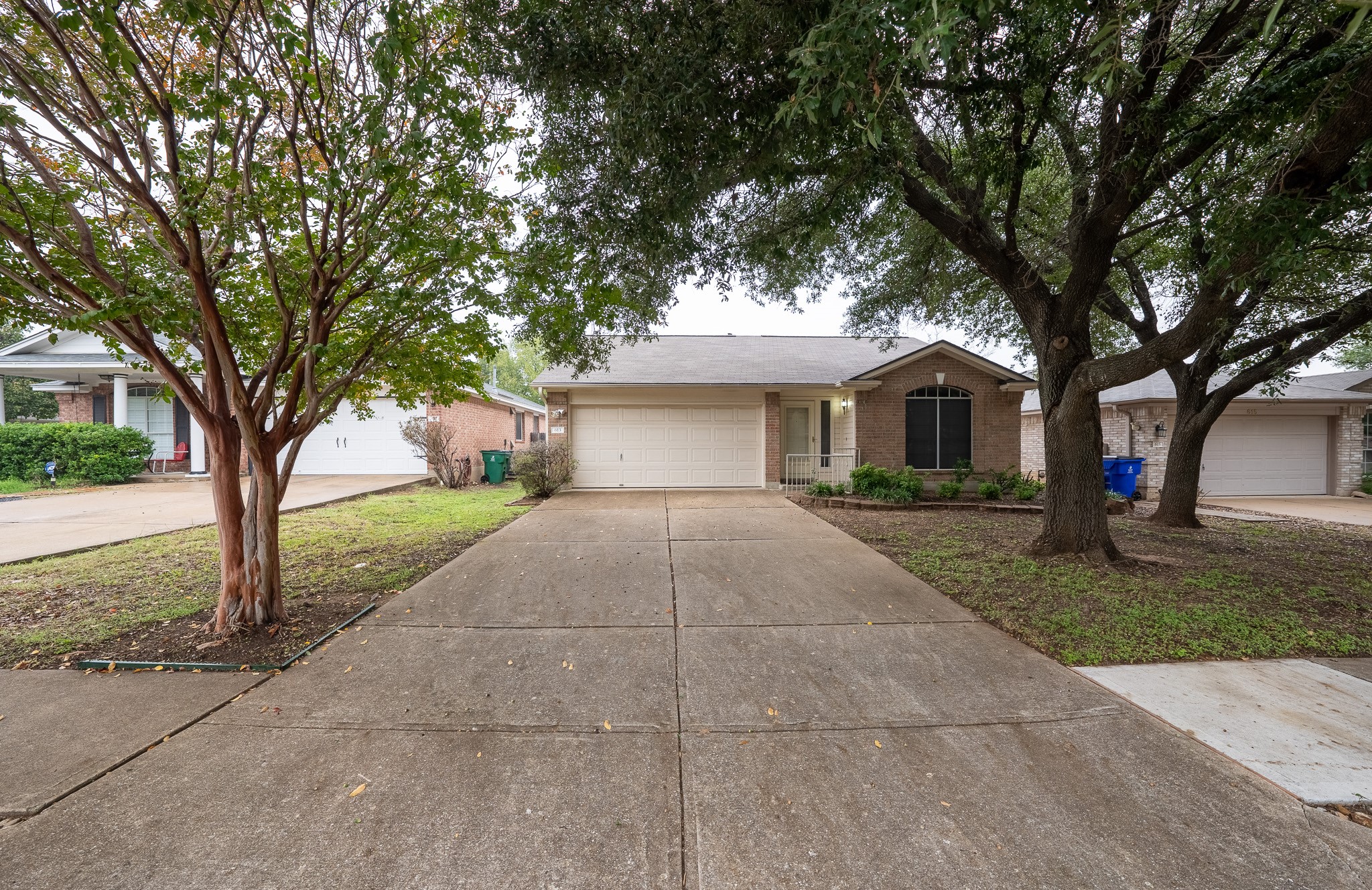 a view of house with outdoor space and tree s