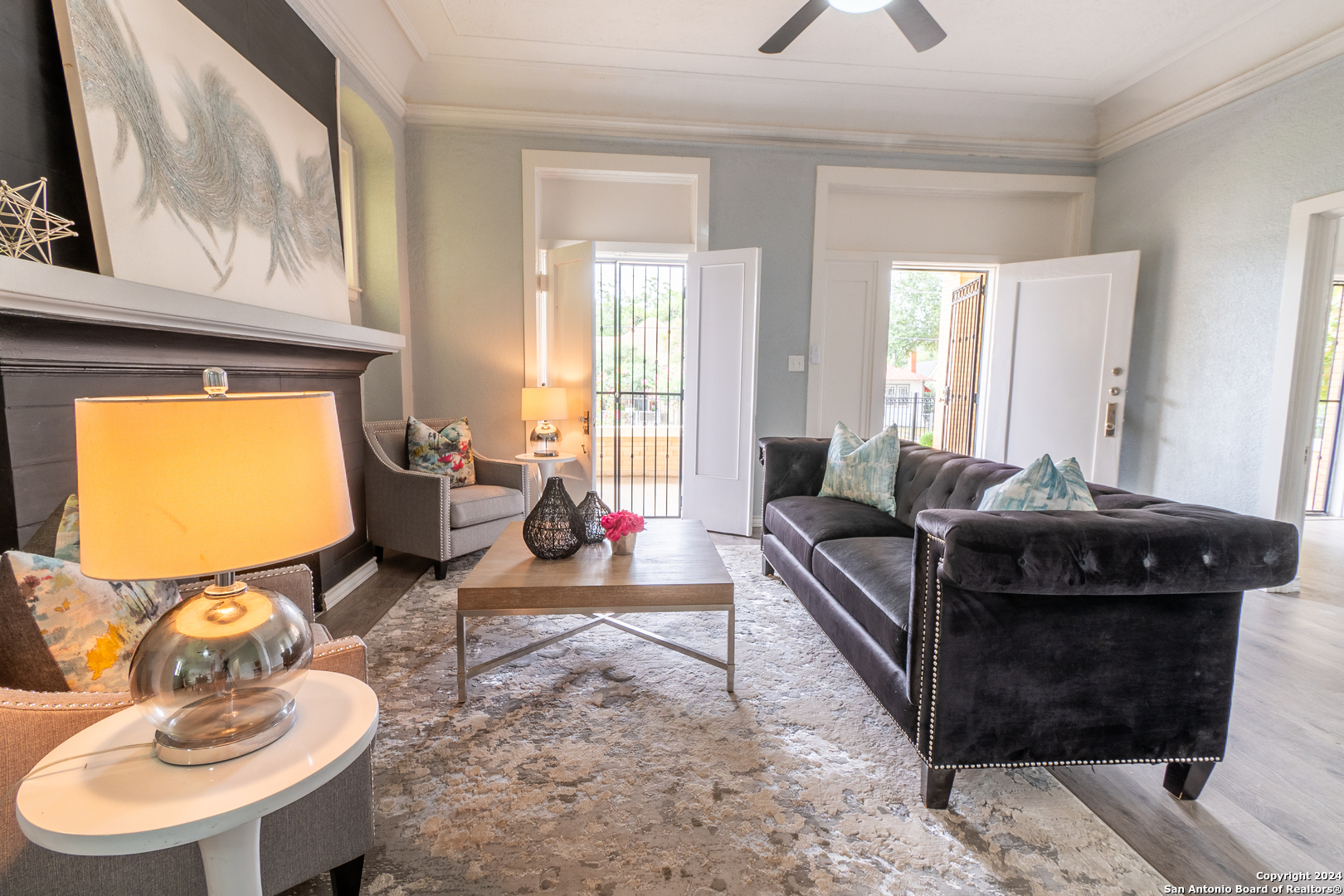 a living room with furniture and a flat screen tv