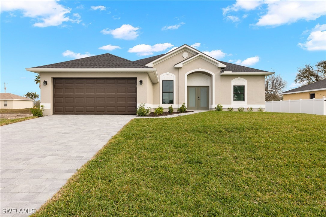 a front view of a house with a yard