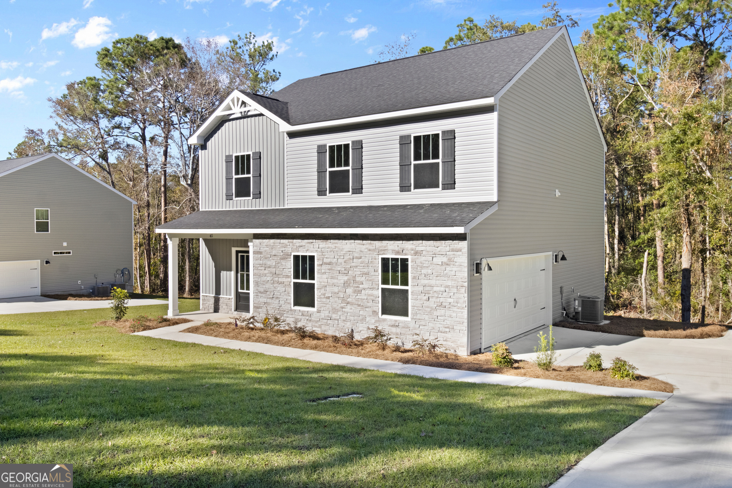 a front view of a house with a yard