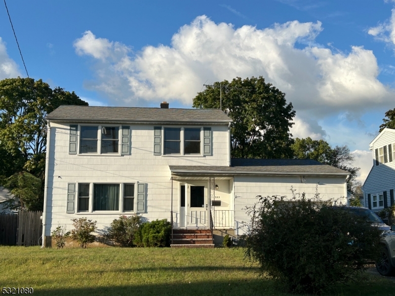 a house view with a garden space