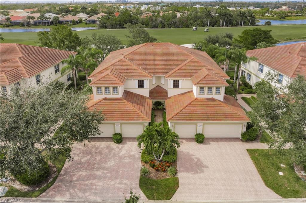 an aerial view of a house with a garden and trees