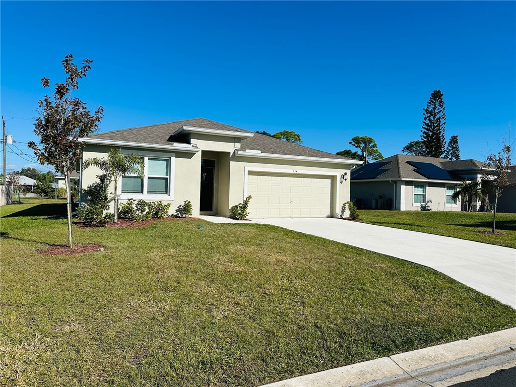 a front view of a house with a yard