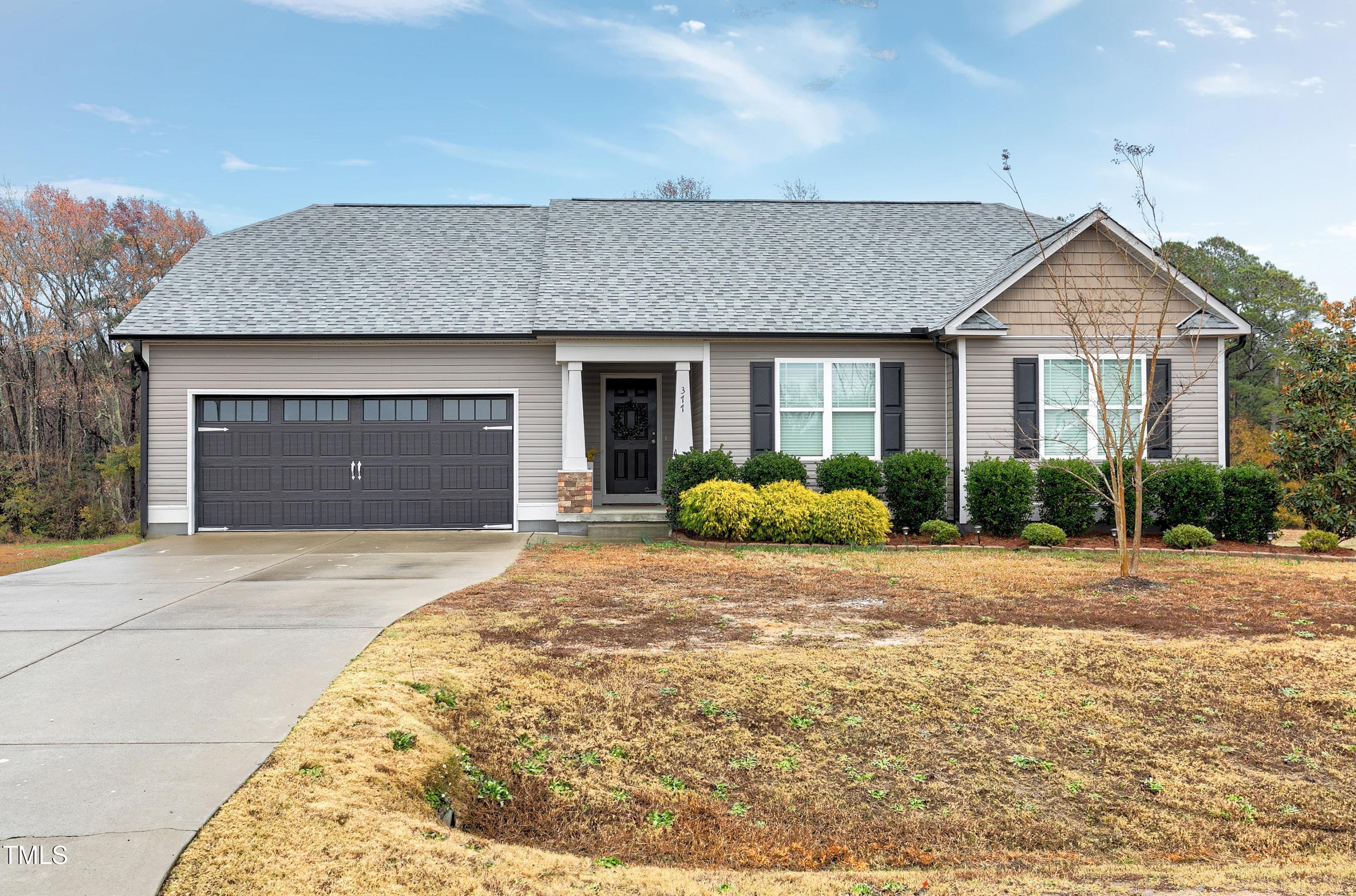 a house with yard in front of it