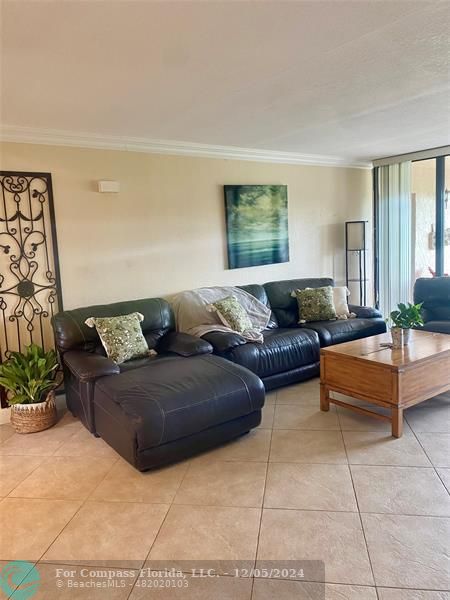 a living room with couches and a coffee table