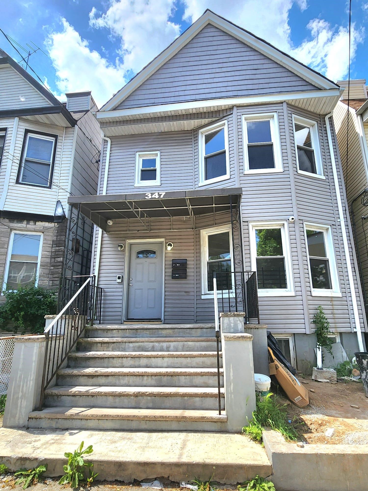 a front view of a house with a porch