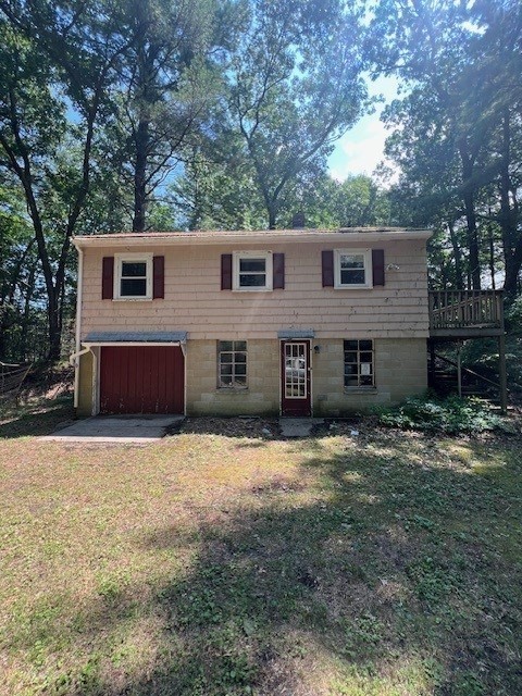 a front view of a house with yard