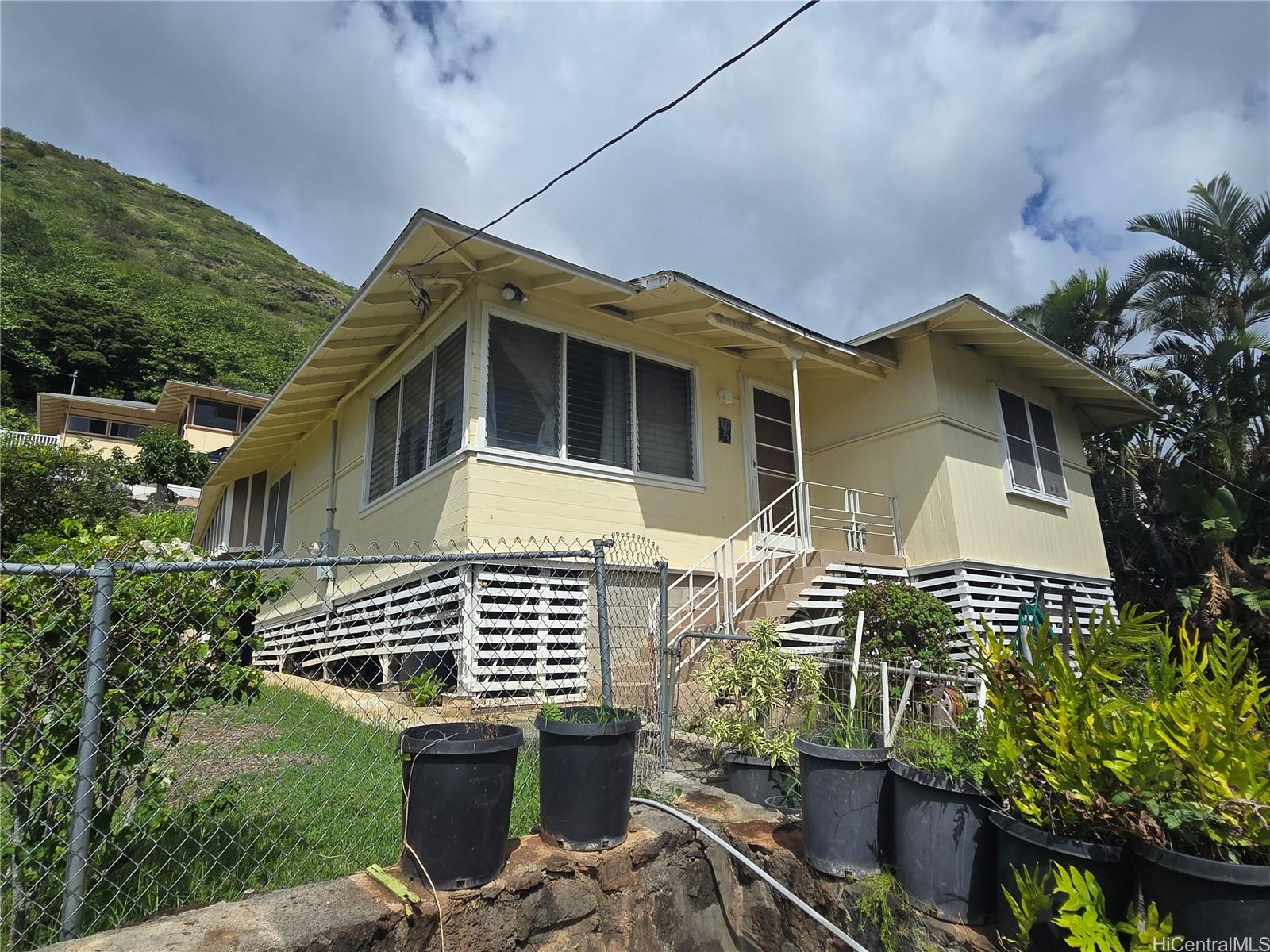 a front view of a house with garden