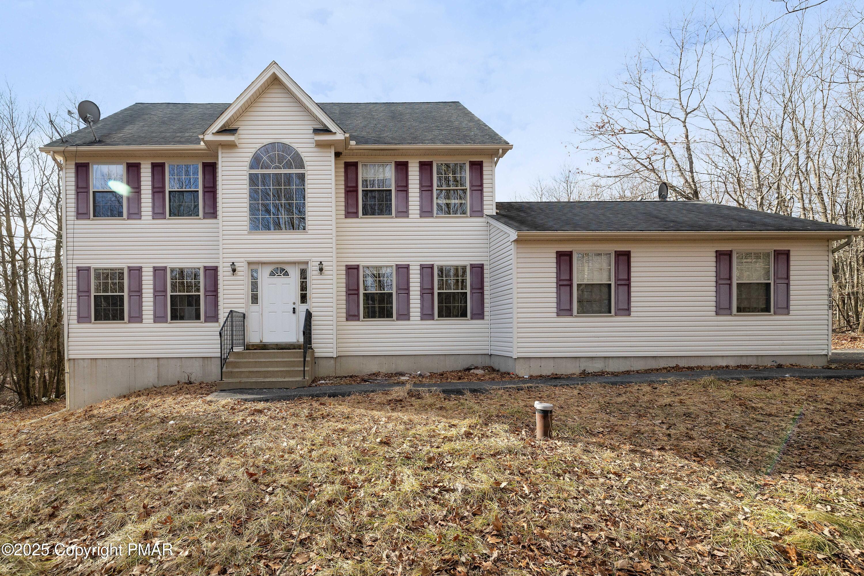 a front view of a house with a yard