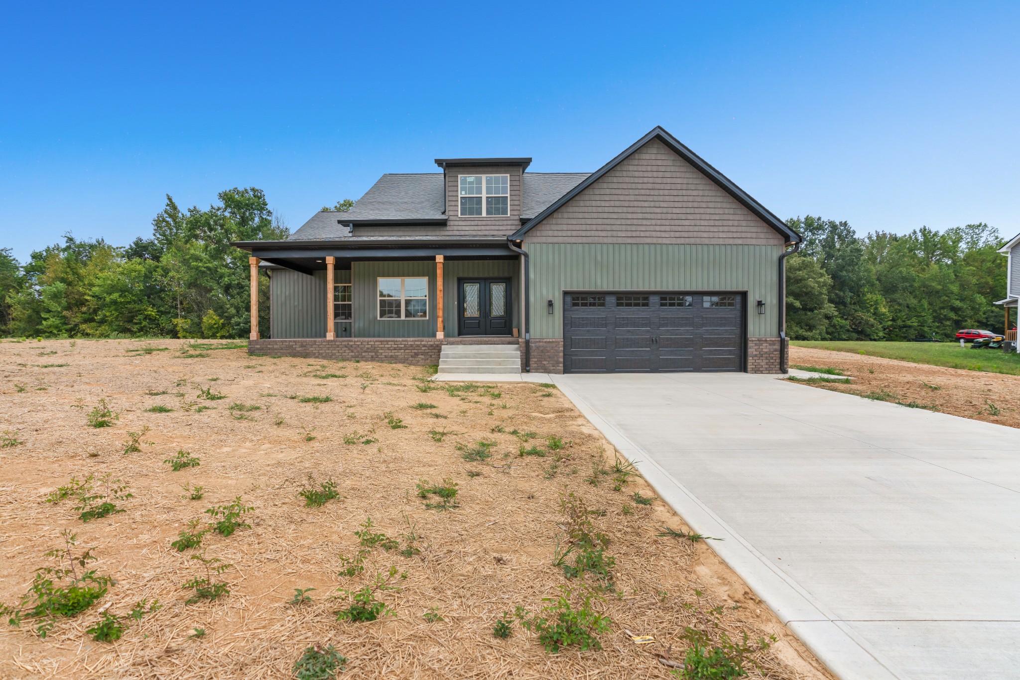 a front view of a house with a yard