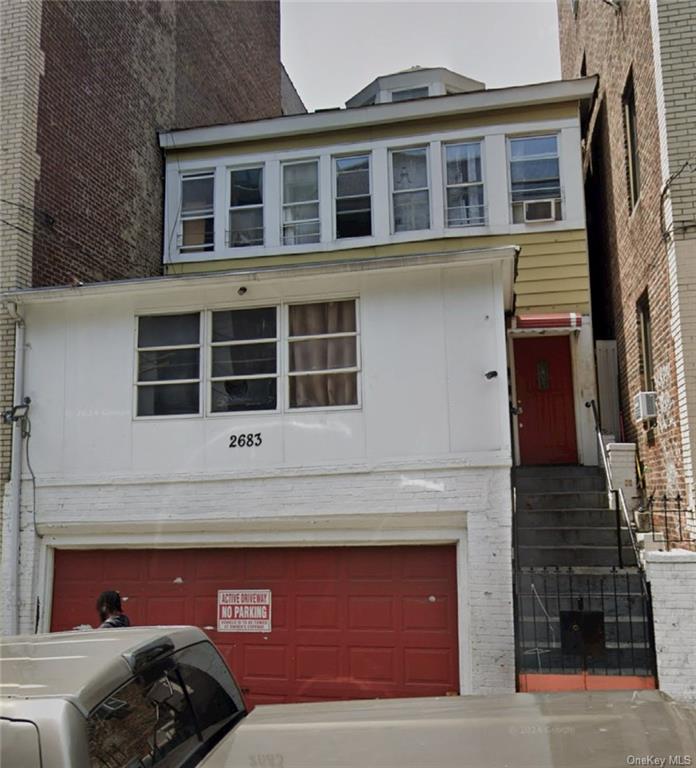 a front view of a house with a garage