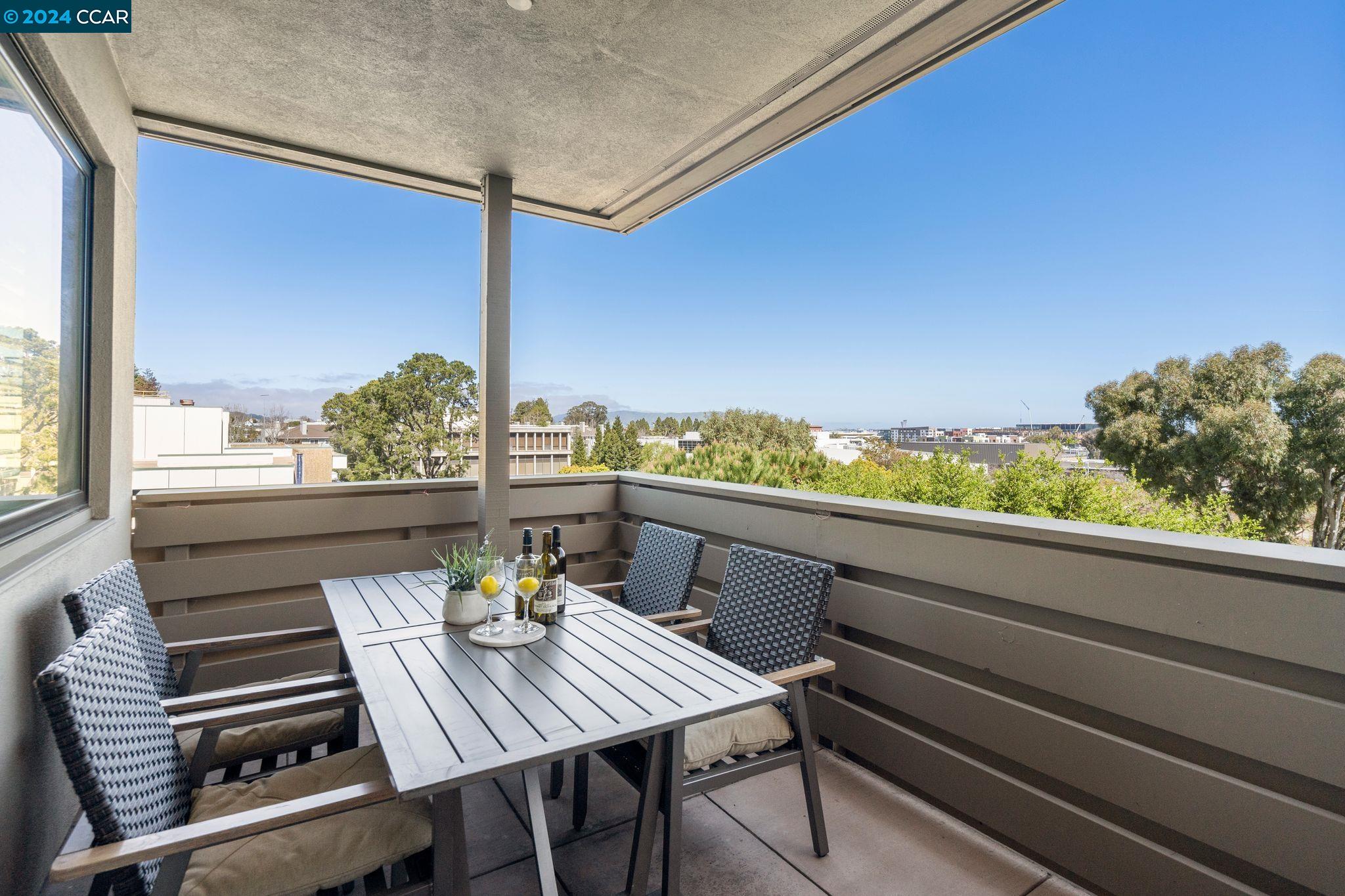 a view of a balcony with chairs