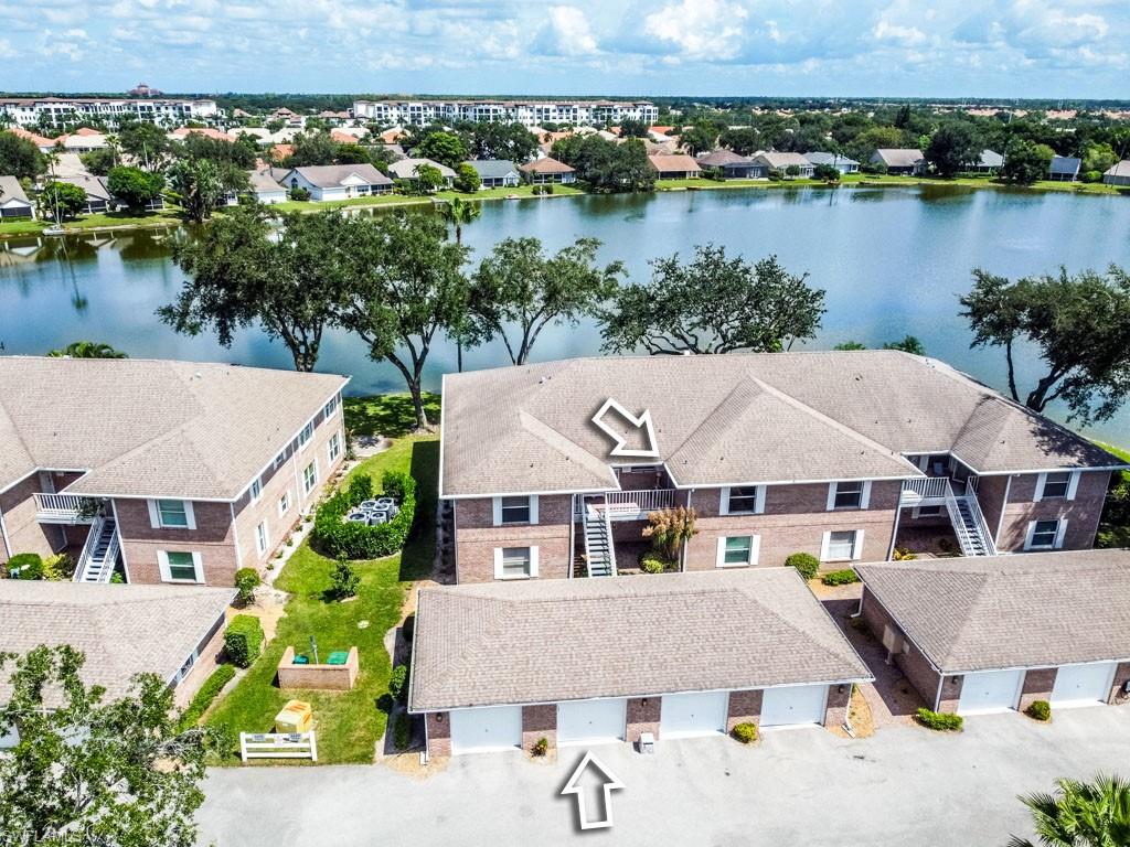 an aerial view of a house with a lake view