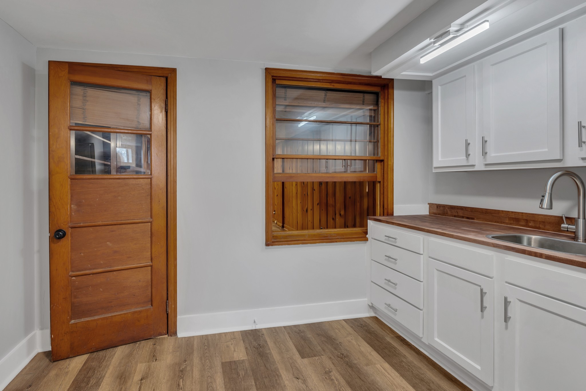 a kitchen with a sink and cabinets