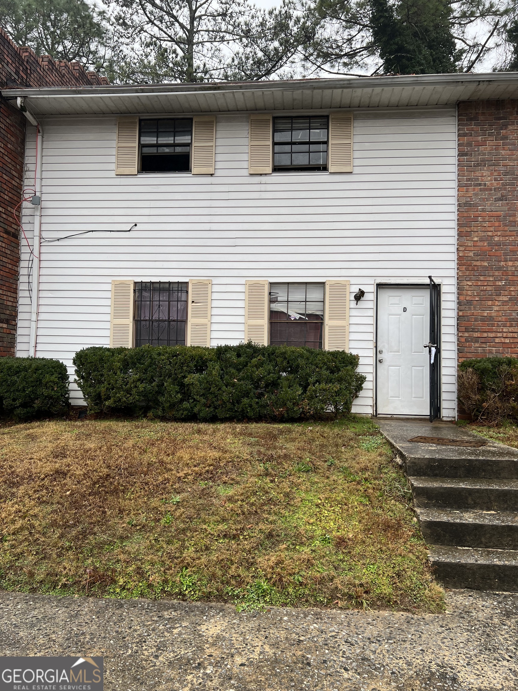 a front view of a house with yard