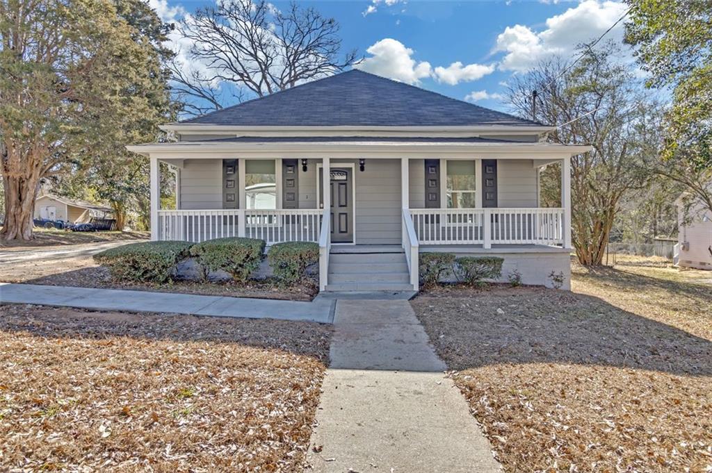 front view of a house with a yard