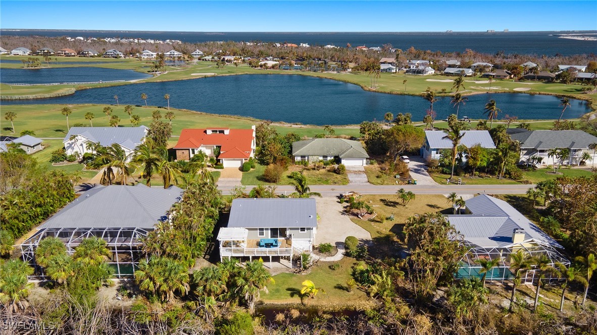 an aerial view of residential building and ocean