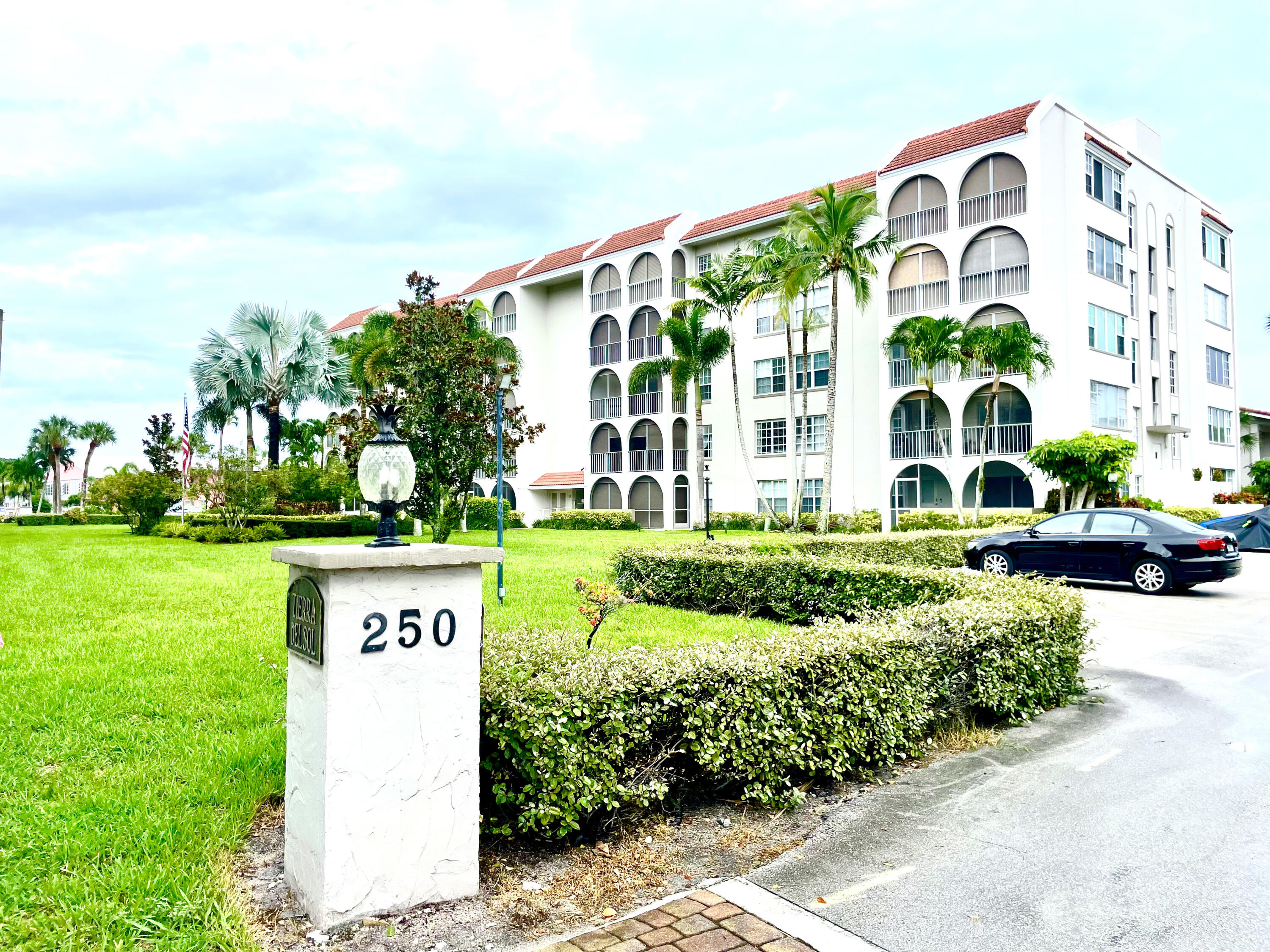 a front view of a building with garden