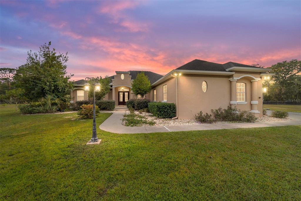 a front view of a house with a yard