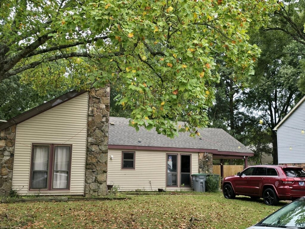 a front view of a house with a garden