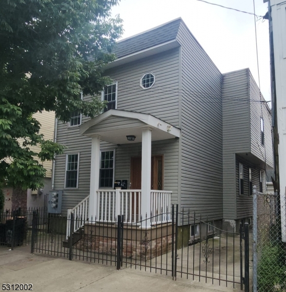 a front view of a house with a porch