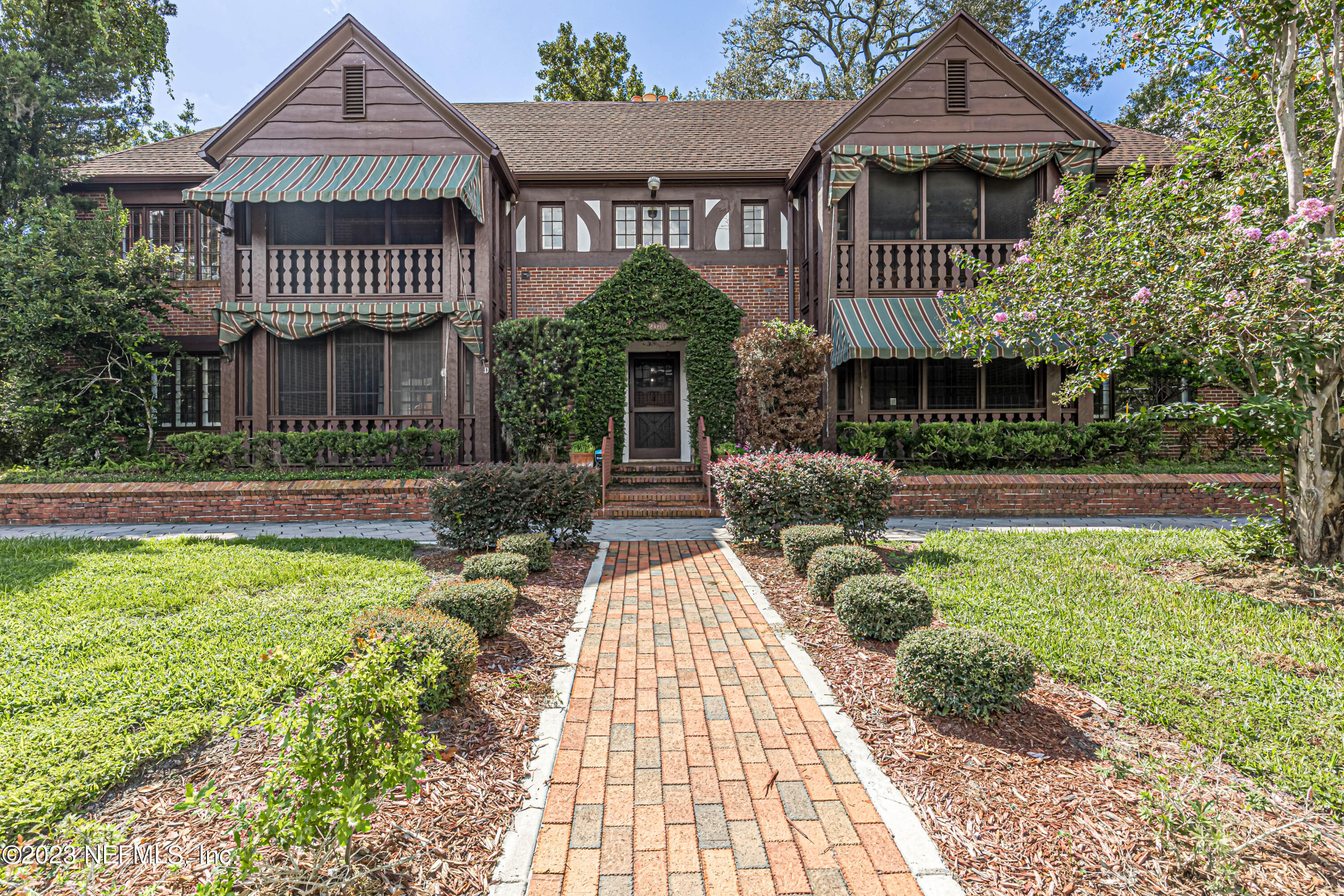 a front view of a house with garden