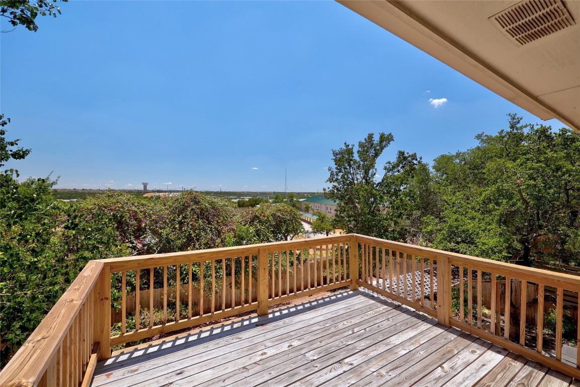 a view of balcony with wooden floor